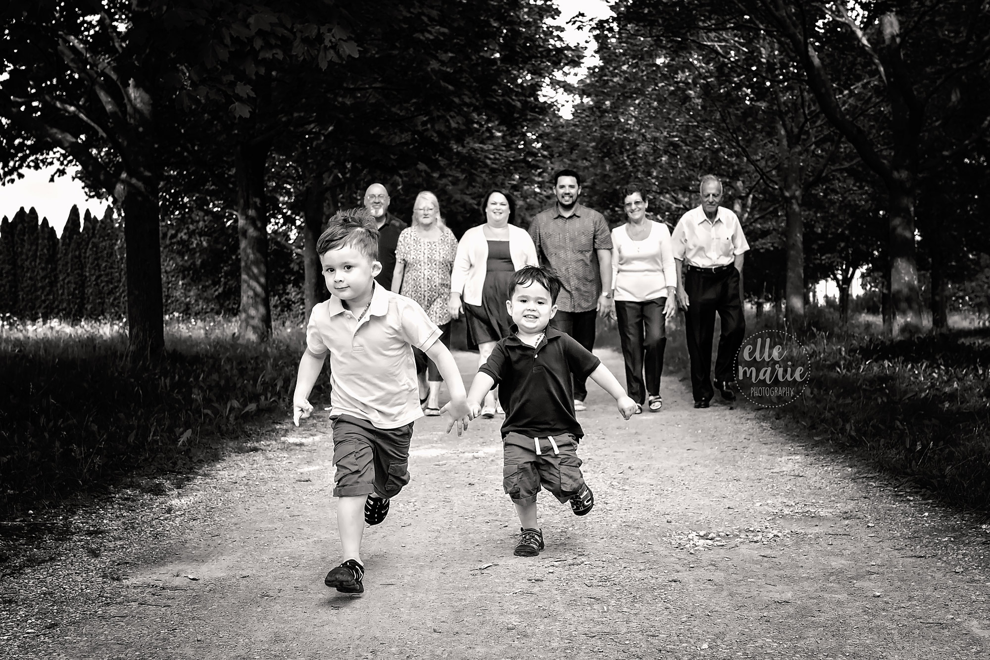 two boys running ahead of their family