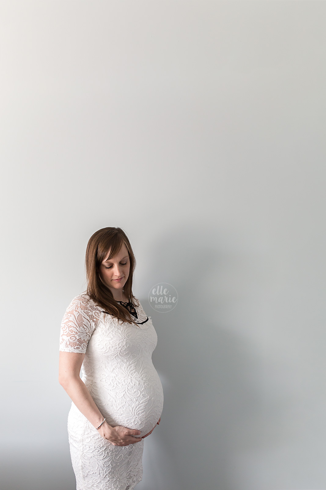 pregnant woman in white dress