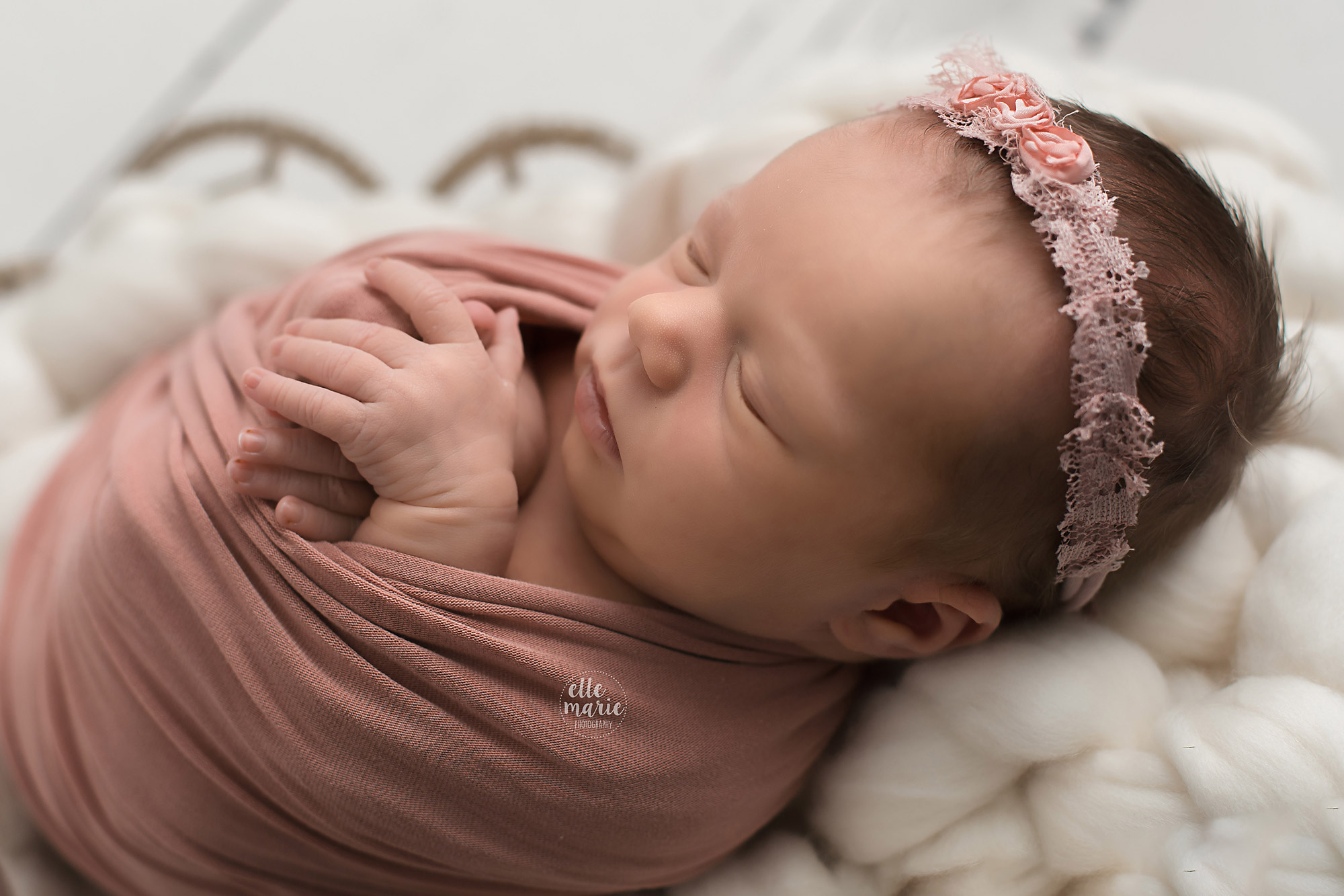 newborn girl in pink