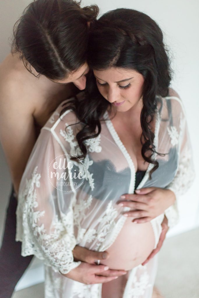 expecting couple in embrace