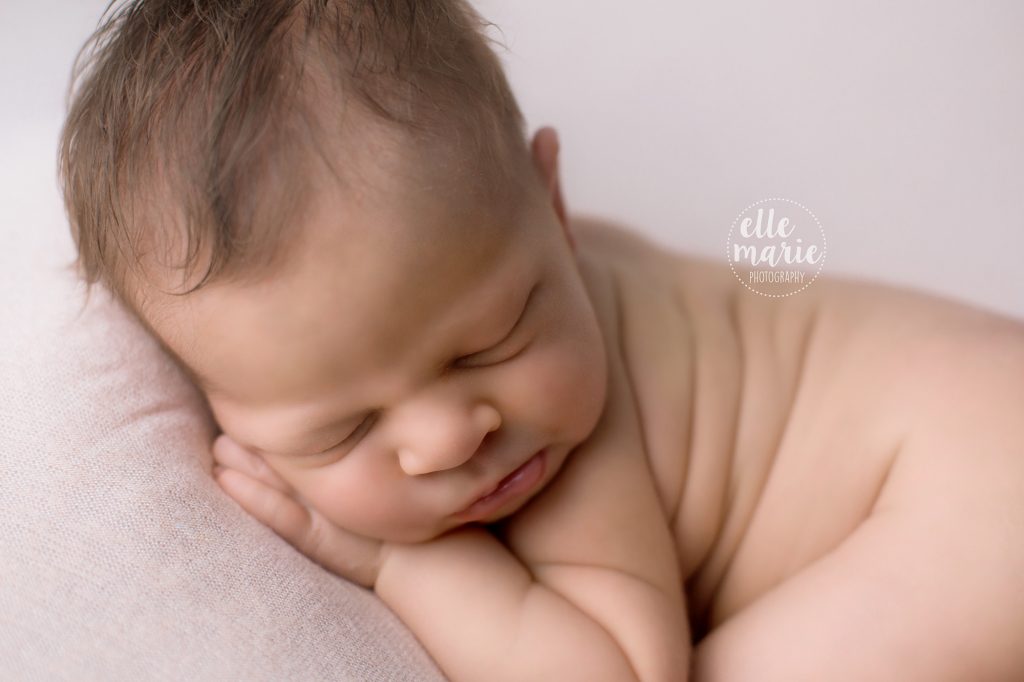 newborn baby girl with pout lips