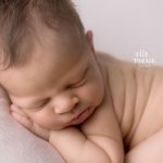 newborn baby girl with pout lips