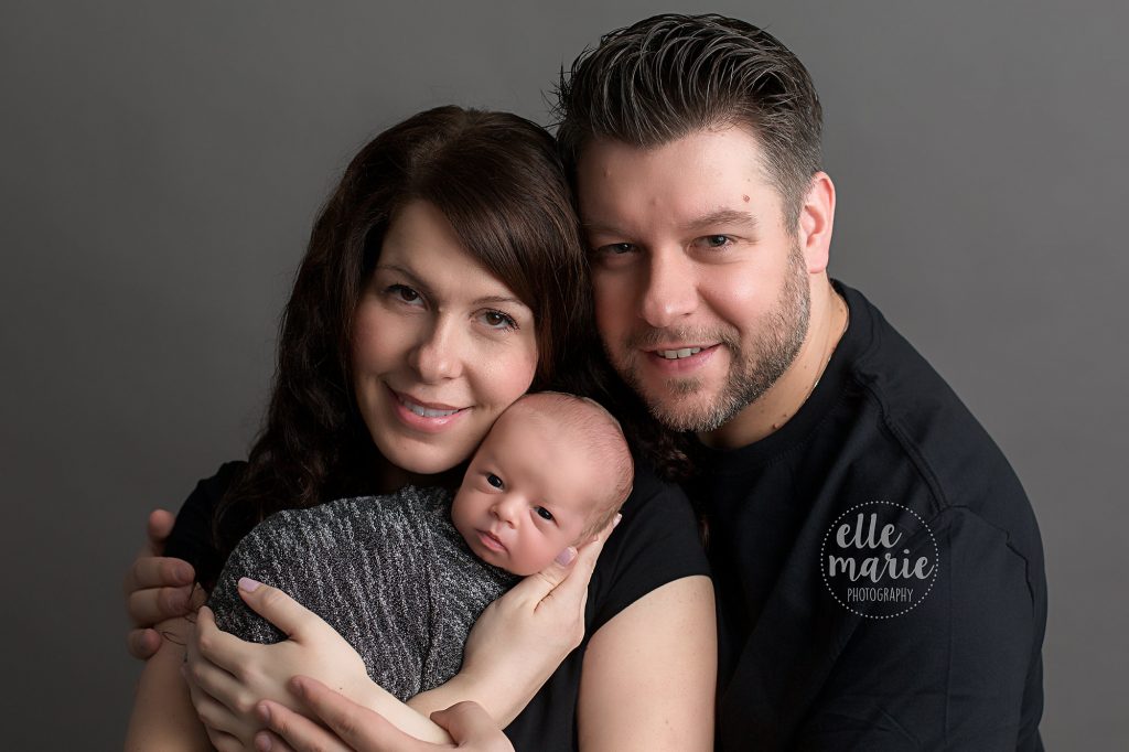 mom and dad with newborn boy