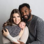 family of 3 with newborn posing