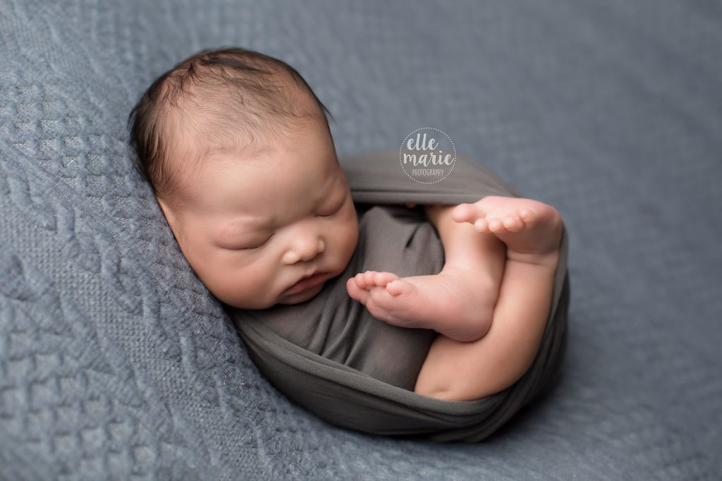 newborn baby boy all wrapped up