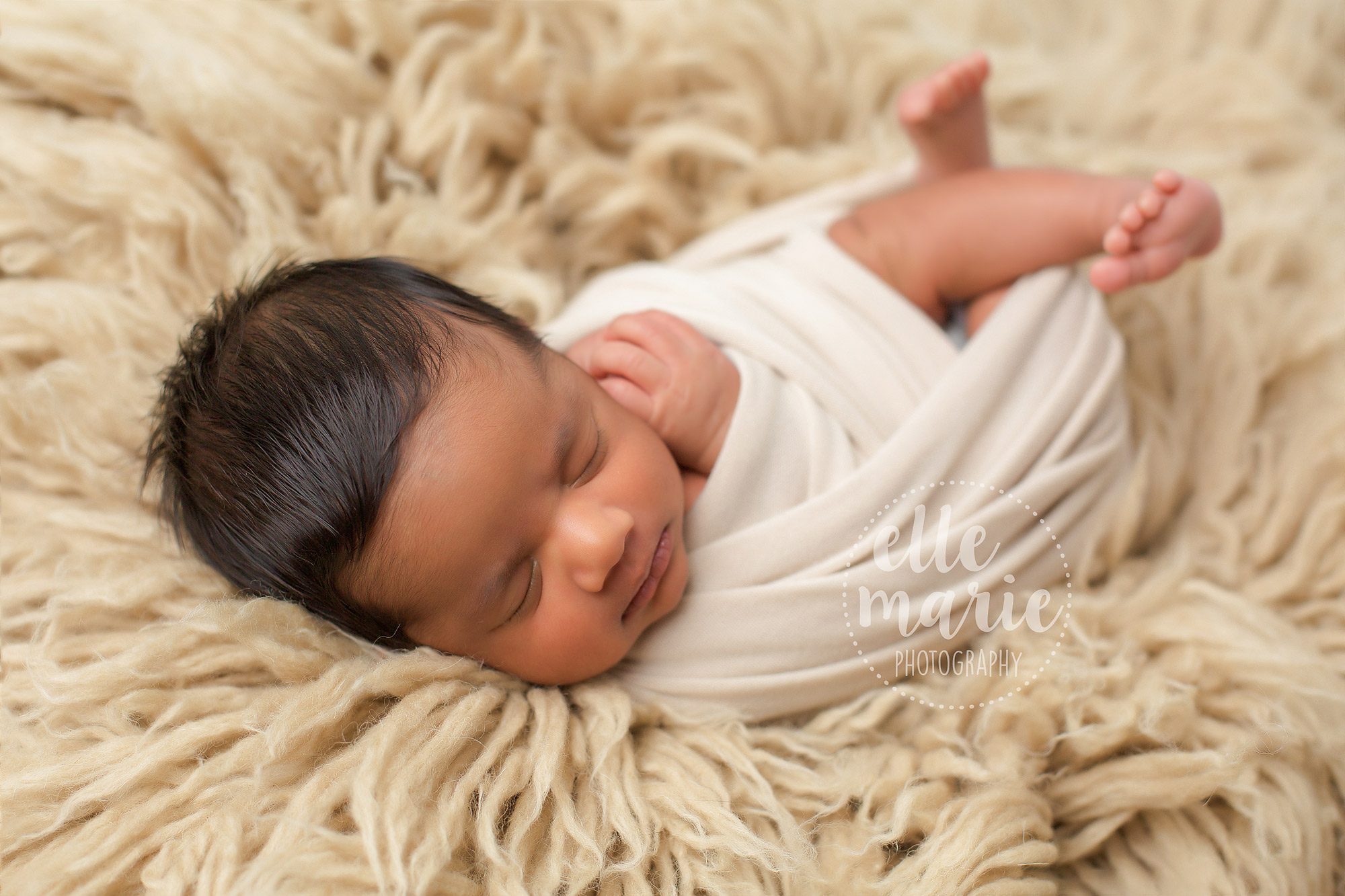 baby boy on tan rug