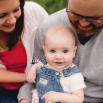 9 month old baby girl with family