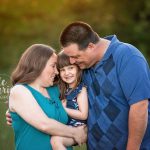 young girl with her mom and dad