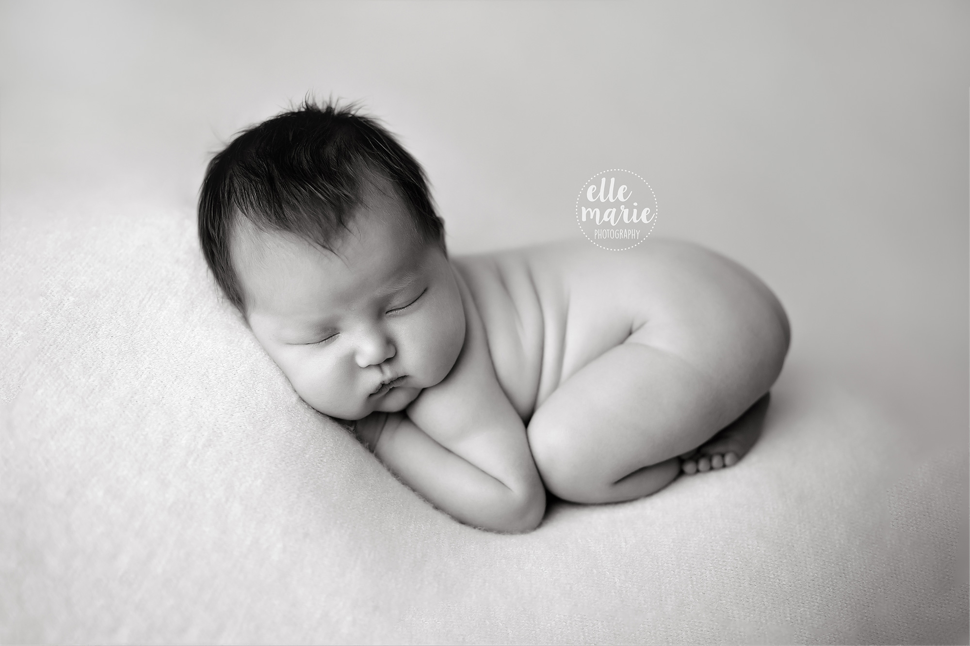 newborn baby in black and white