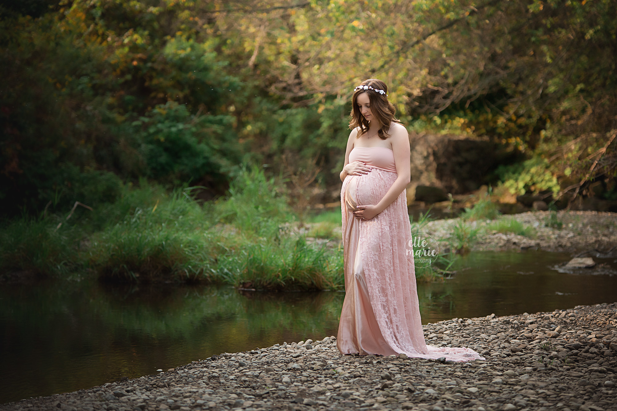 expecting mother wearing pink maternity dress