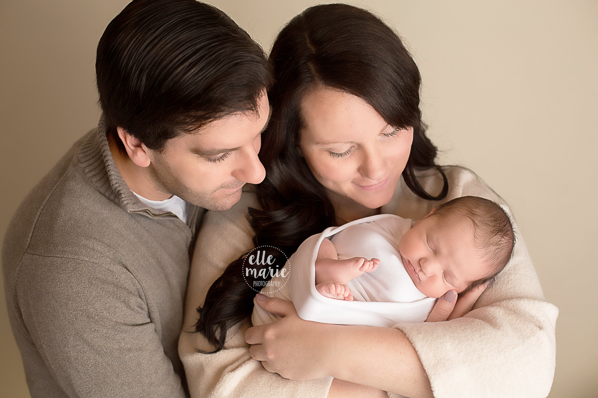 newborn baby with mom and dad