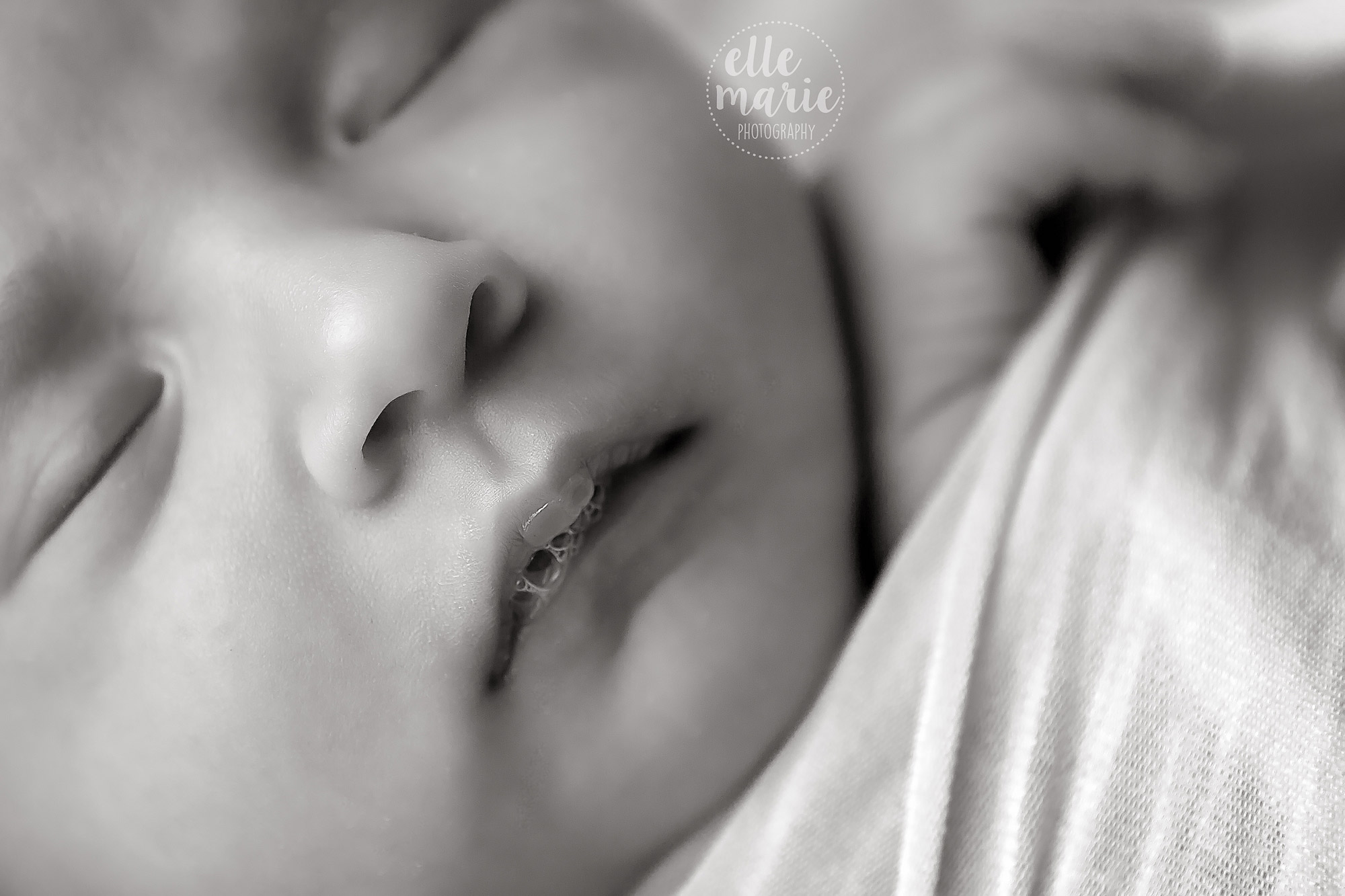 close up of newborn lip bubbles