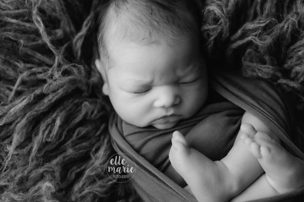 black and white image of newborn baby boy