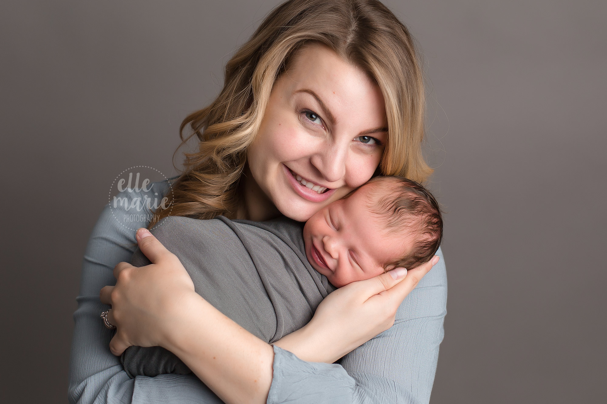 new mom holding newborn baby boy