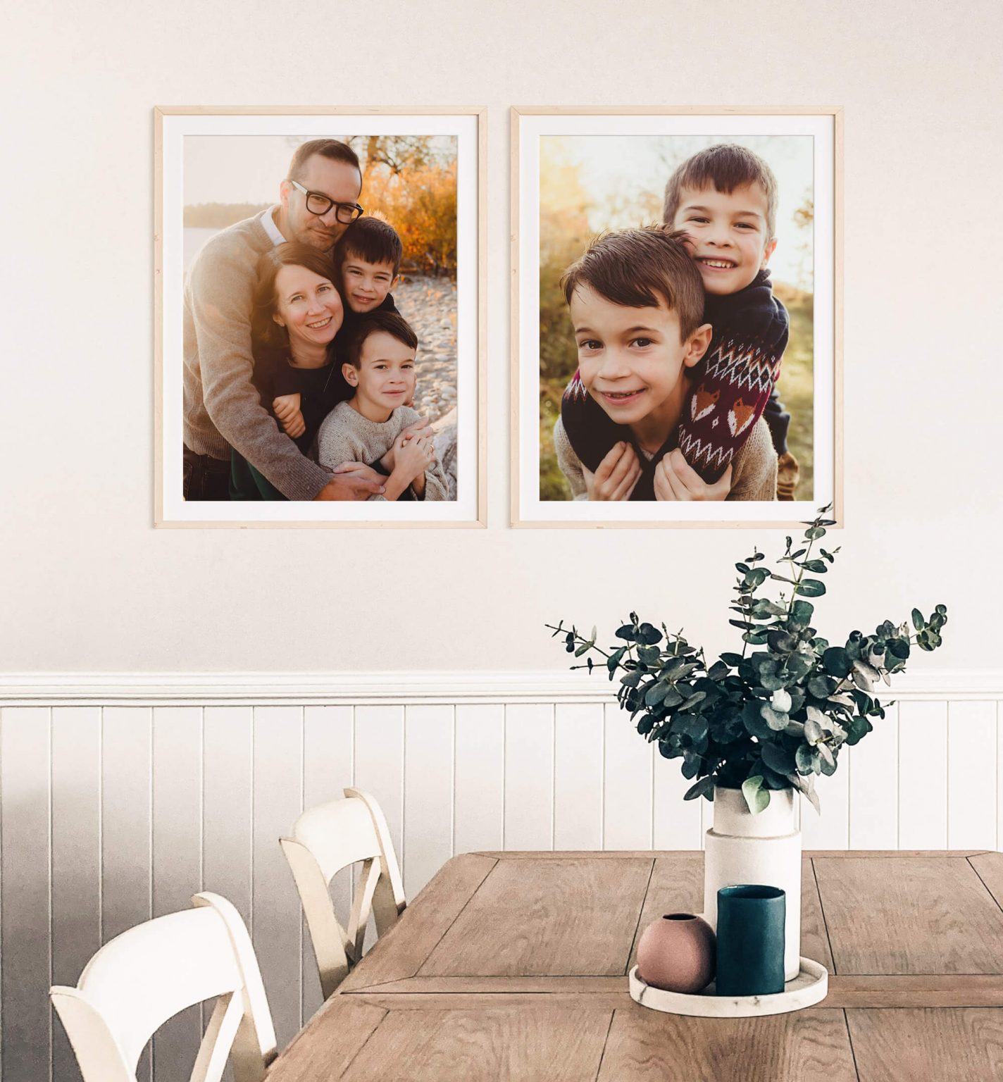 Photo of a family dining area featuring 2 framed family photos on the wall