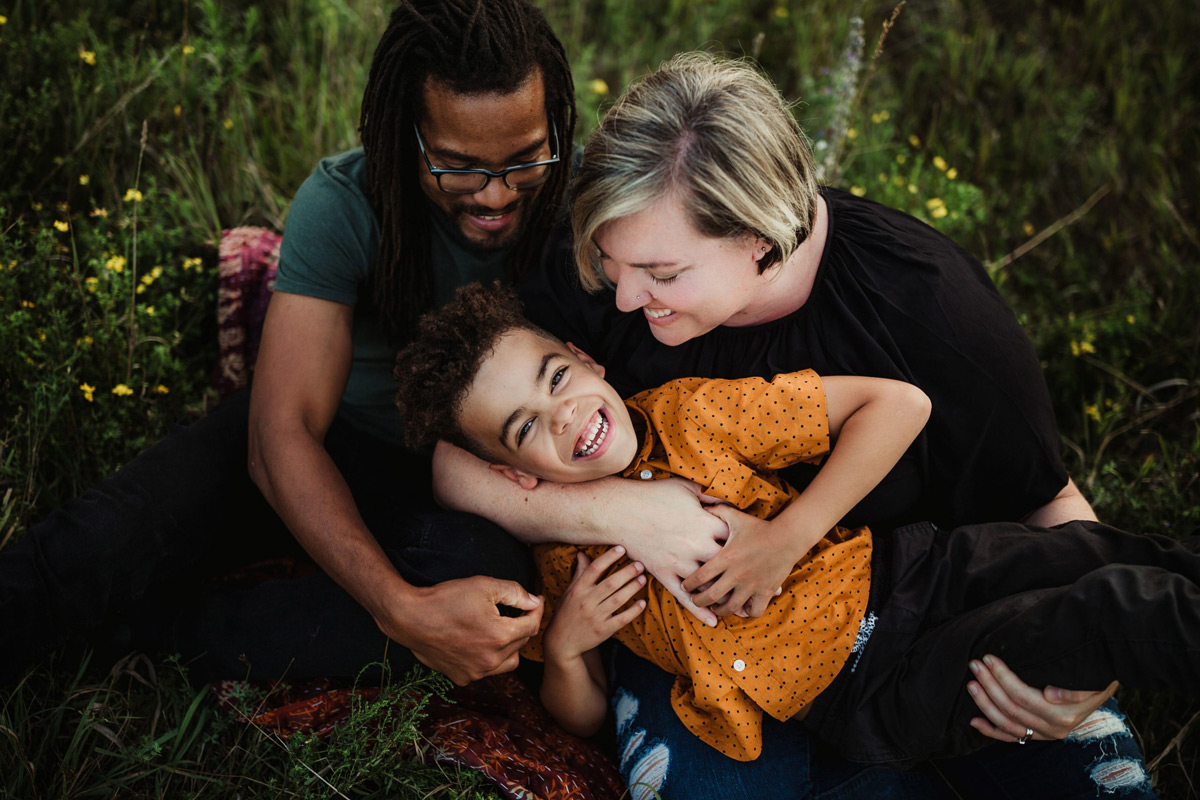 Lyndsey Thomas and her husband tickling their son