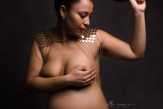 a pregnant woman posing nude