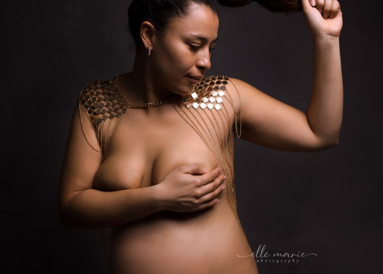 a pregnant woman posing nude