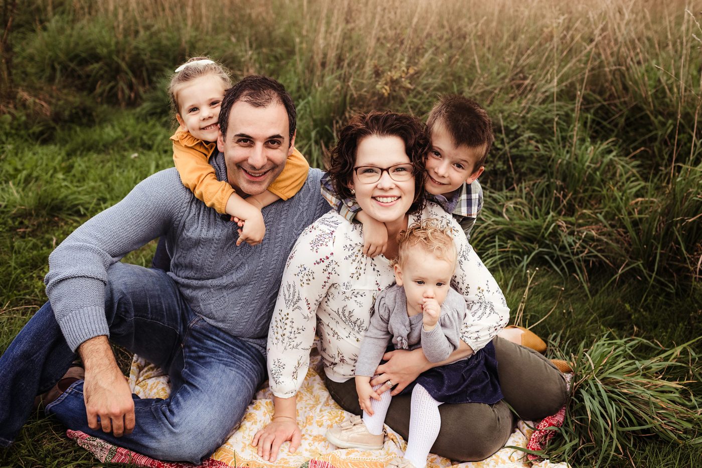 family of 5 snuggling together for a photo