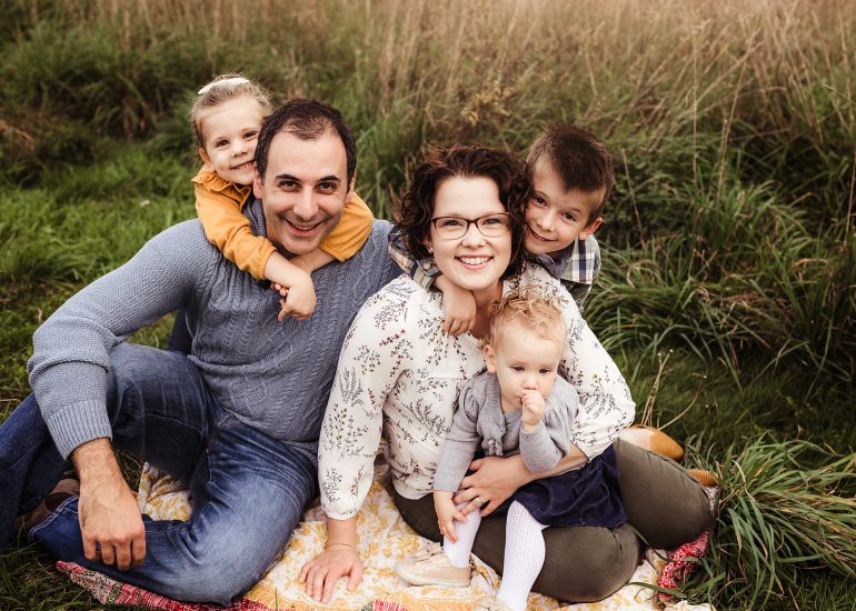 family of 5 snuggling together for a photo